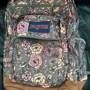 Grey flowery backpack .